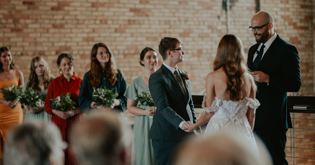 Joseph Kuilema, right, officiates the wedding of Nicole, left, and Annica Sweda.