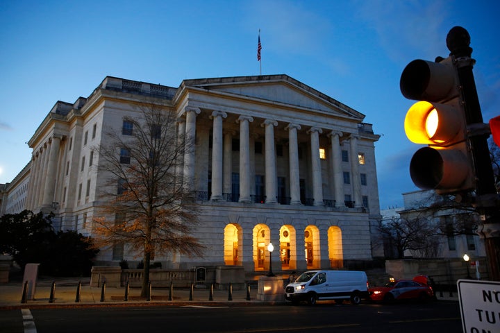 A traffic light changes outside Longworth House Office Building in Washington, early Wednesday, Dec. 4, 2019. (AP / Patrick Semansky)