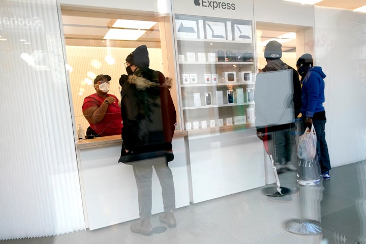 Customers pick up online orders at the Apple Store at the Towson Town Center. The store just became the company's first to unionize.