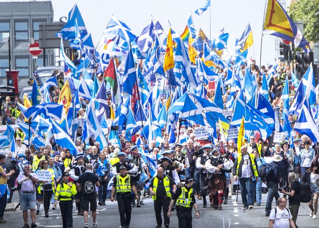 Scottish independence supporters march through Glasgow during an All Under One Banner march. Picture date: Saturday May 14, 2022.