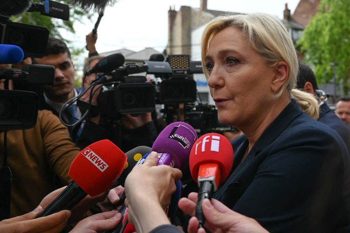 Marine Le Pen, leader of France's far-right National Rally (RN) party, talks to the press a day after the first results of the parliamentary elections in Henin-Beaumont, northern France, on June 20, 2022. 