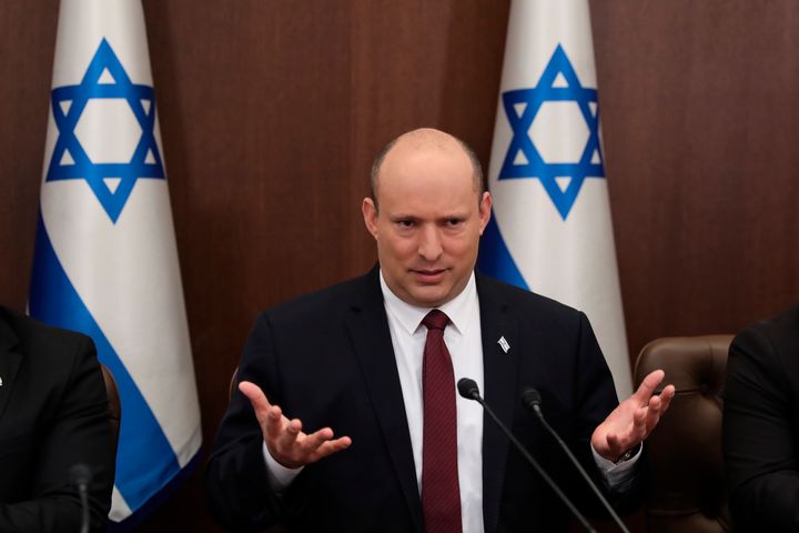 Israeli Prime Minister Naftali Bennett attends a cabinet meeting at the Prime Minister's office in Jerusalem, Sunday, June 19, 2022. Bennett's office announced on Monday, June 20, 2022, that his weakened coalition will be disbanded and the country will head to new elections. Bennett has struggled to keep his unruly coalition of eight parties together, and defections have left the crumbling alliance without a majority in parliament for over two months. (Abir Sultan/Pool Photo via AP, File)