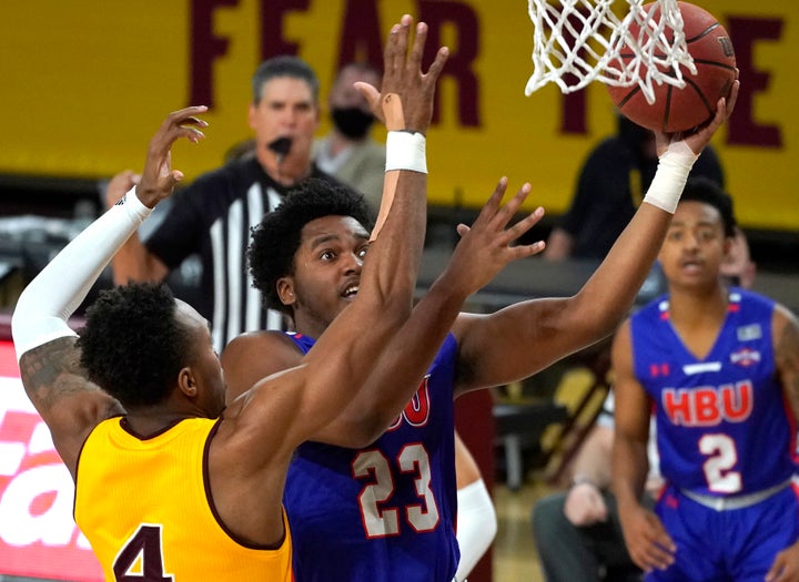 Houston Baptist guard Darius Lee jumps for a layup during the first half of an NCAA college basketball game against Arizona State, Nov. 29, 2020, in Tempe, Arizona. Lee was killed and eight other people were wounded Monday in an early-morning shooting at a gathering in Harlem, New York City police said. 