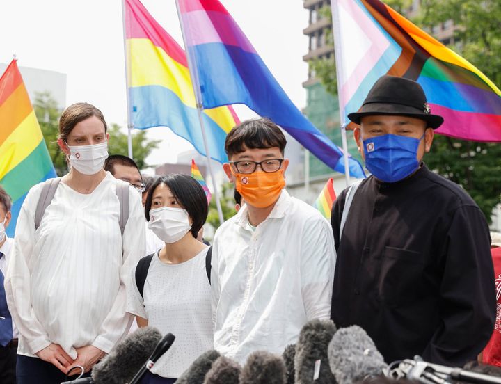 Plaintiffs speak to journalists after a court ruling in Osaka, western Japan, on June 20, 2022. The Osaka District Court ruled Monday that the country’s ban on same-sex marriage does not violate the constitution, and rejected demands for compensation by three couples who said their right to free union and equality has been violated. 