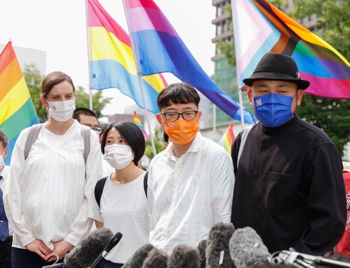 Plaintiffs speak to journalists after a court ruling in Osaka, western Japan, on June 20, 2022. The Osaka District Court ruled Monday that the country’s ban on same-sex marriage does not violate the constitution, and rejected demands for compensation by three couples who said their right to free union and equality has been violated.