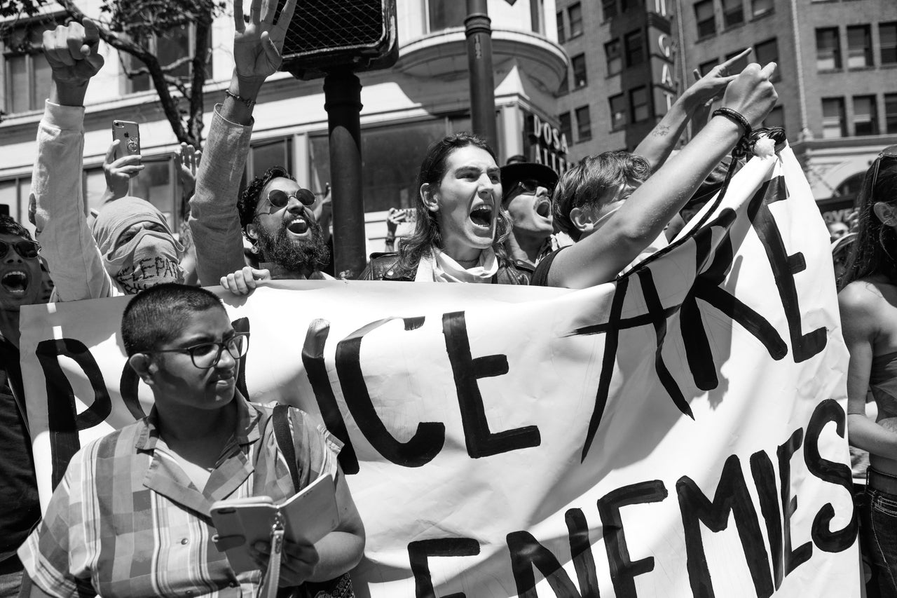 People cheer as police back off after a protesters demonstrated on Market Street during the Pride Parade in San Francisco, June 30, 2019. The group was anti-police and against the corporations participating in the parade.