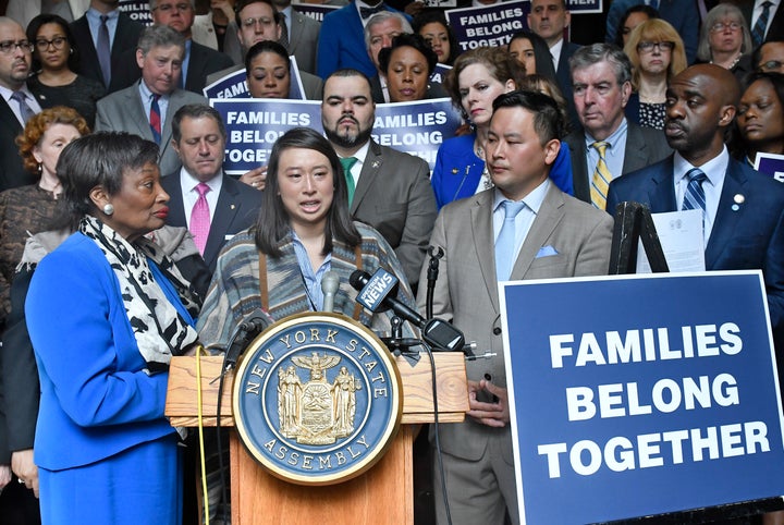 Assemblywoman Yuh-Line Niou, center, speaks at a gathering of New York state lawmakers rallying against then-President Donald Trump's immigration policies in 2018.
