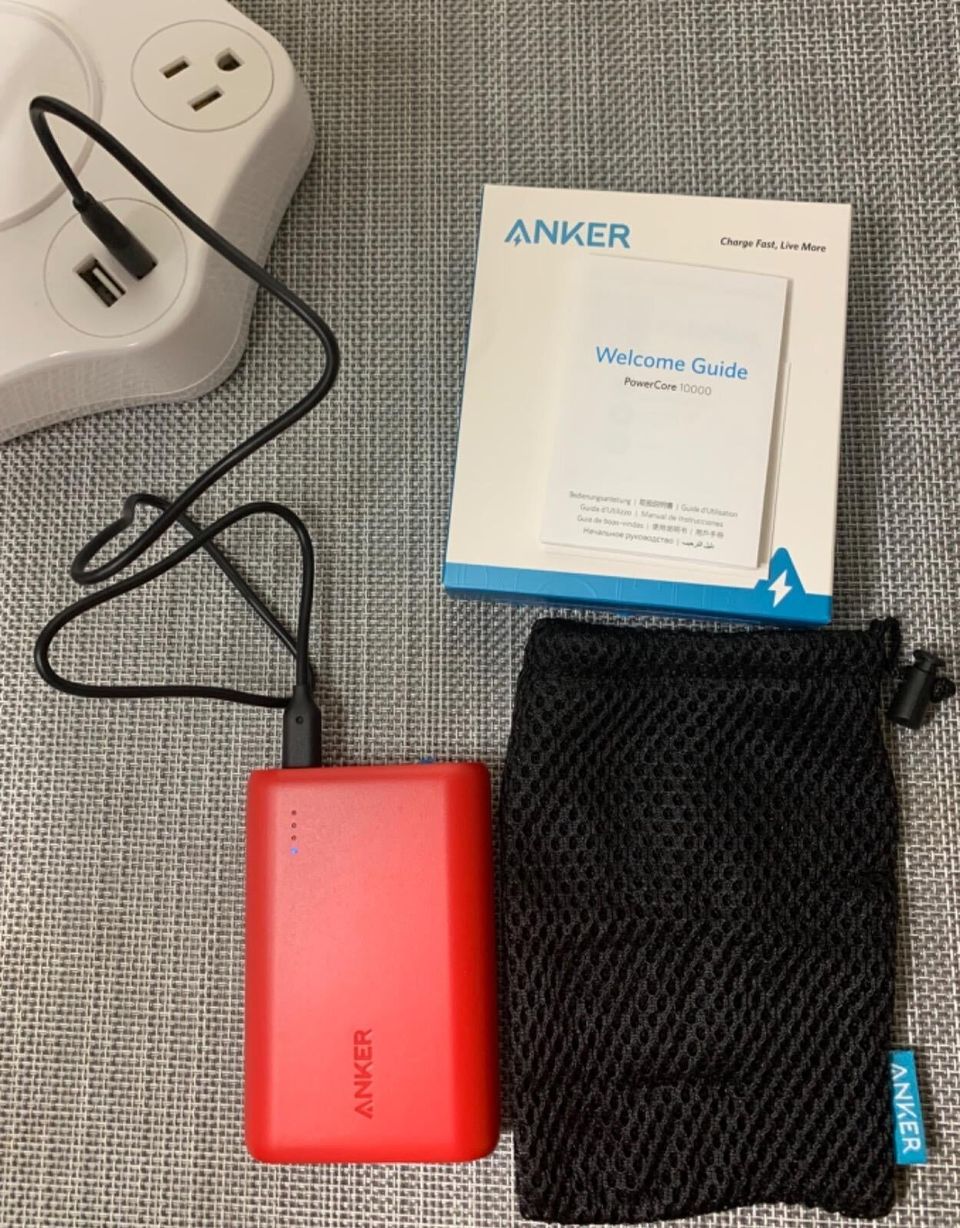 A portable charger because a dead phone is one of the worst things that can happen while traveling