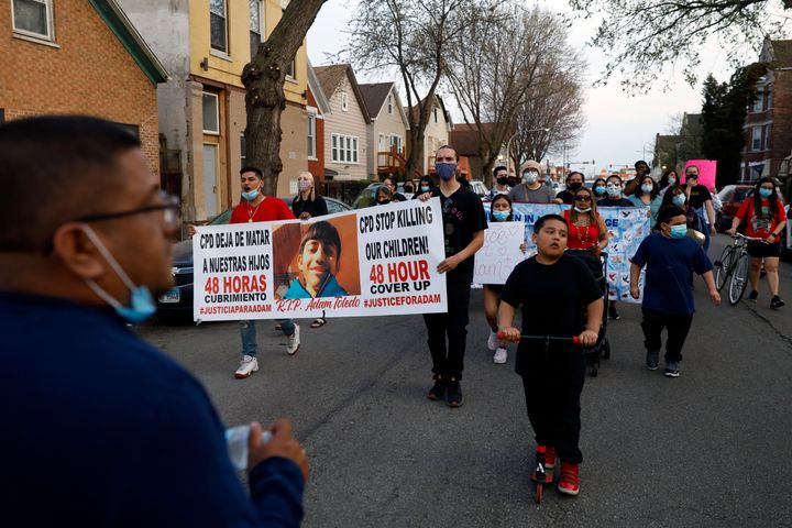 In this Tuesday, April 6, 2021 photo, members of Chicago's Little Village Community Council march to protest against the death of 13-year-old Adam Toledo, who was shot by a Chicago Police officer at about 2 a.m. on March 29 in an alley west of the 2300 block of South Sawyer Avenue near Farragut Career Academy High School.