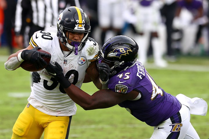 Jaylon Ferguson tackles the Steelers' James Conner successful a 2020 game.