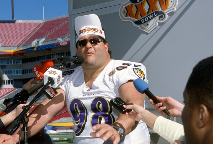 Tony Siragusa of the Baltimore Ravens talks with the media prior to playing the New York Giants in Super Bowl XXXV at Raymond James Stadium on Jan. 28, 2001, in Tampa, Florida.