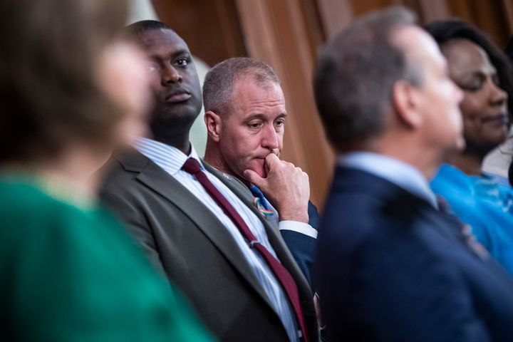 Rep. Mondaire Jones (D-N.Y.), second from left, and Rep. Sean Patrick Maloney (D-N.Y.), center, in the U.S. Capitol. Maloney decided to run in Jones' old seat.