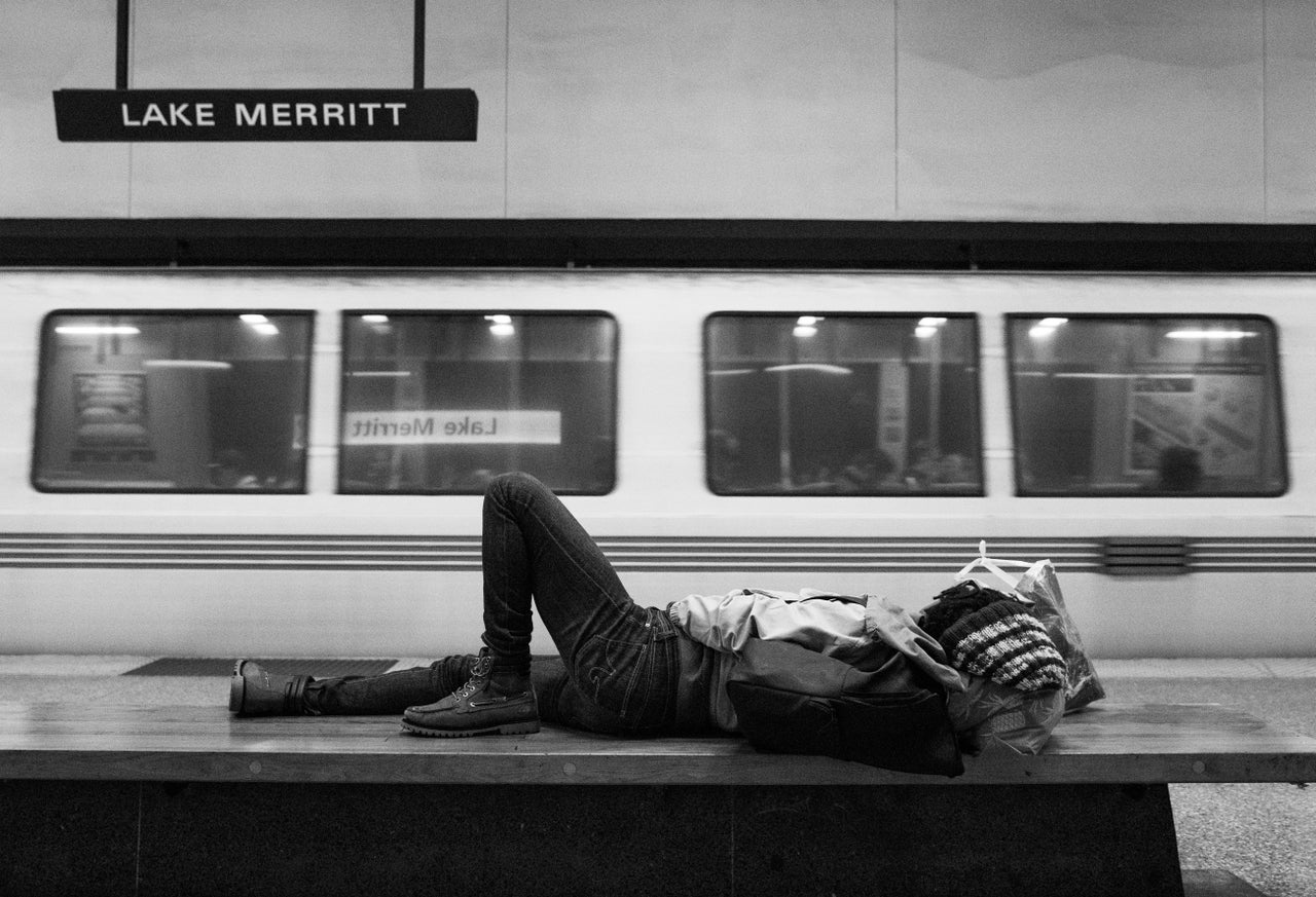 A homeless woman sleeps on a bench at a BART station in Oakland, California. Telling the story of contemporary violence against Black women and girls means taking stock of the ways we routinely harm those on the margins.