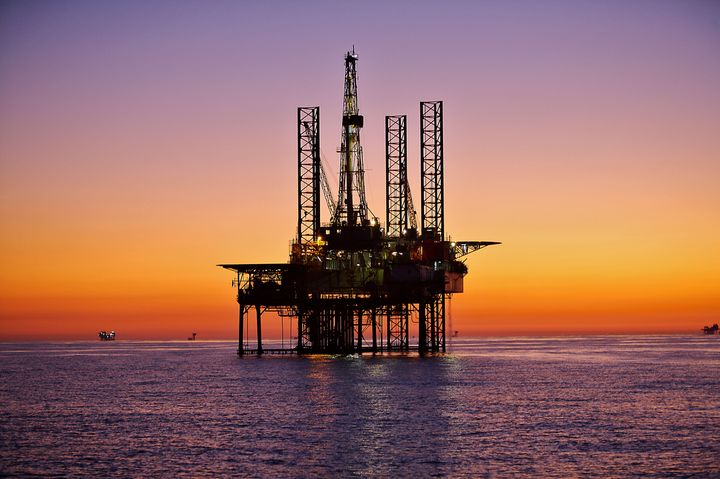 Oil drilling platforms dot the horizon in the Gulf of Mexico. The wells and infrastructure can be used for carbon dioxide storage in the Gulf.