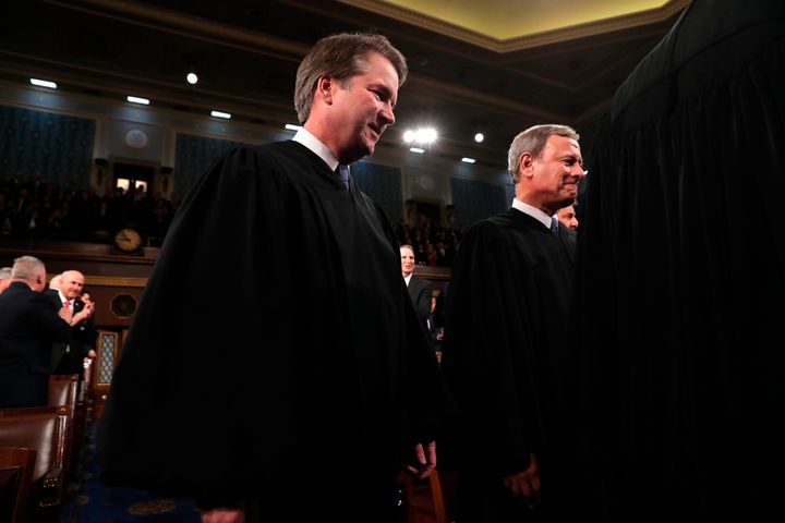 Supreme Court Chief Justice John Roberts, right, and Associate Justice Brett Kavanaugh, left, issued a concurrence in a key gun rights case that stated limits to the majority opinion they joined.