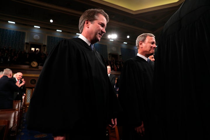Supreme Court Chief Justice John Roberts, right, and Associate Justice Brett Kavanaugh, left, issued a concurrence successful a cardinal weapon rights lawsuit that stated limits to the bulk sentiment they joined.