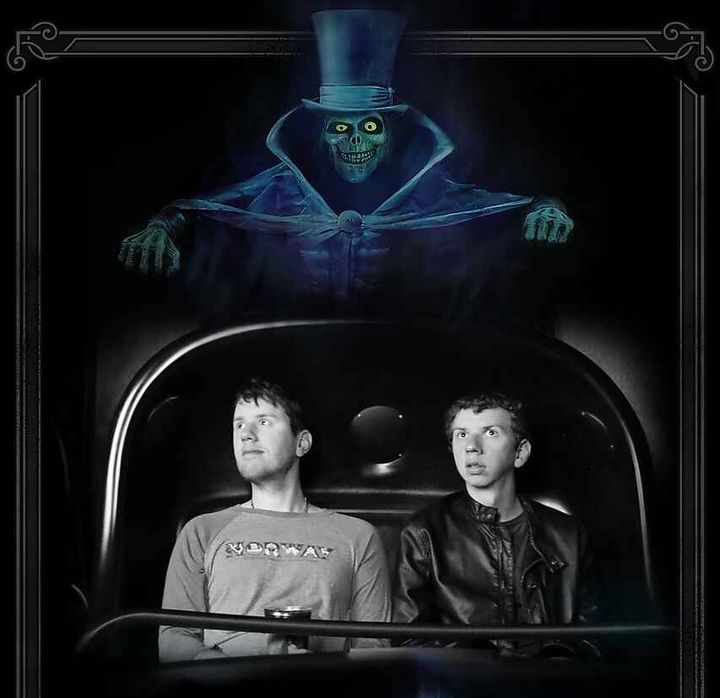 Justin Hermes (left) and a friend on the Haunted Mansion. He runs the site themickeywiki.com.