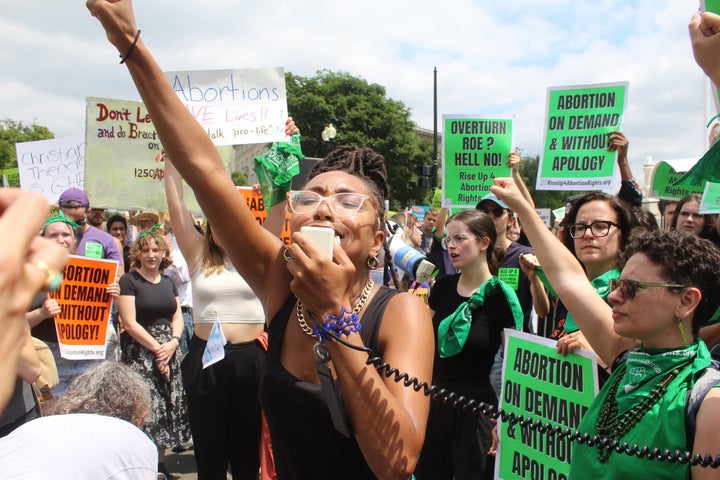 Elizabeth White, 30, leads a chant during a fiery rally after the Supreme Court overturned Roe v. Wade on Friday.