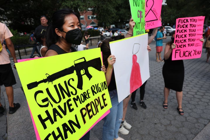 People gather at Union Square to protest the Supreme Court's rulings this week on guns and abortion rights.