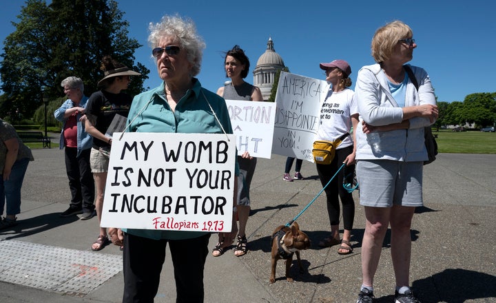 Dr. Kathleen O'Shaunessy of Olympia joins supporters of women's rights as they rally on the Capitol Campus in Olympia, Washington.