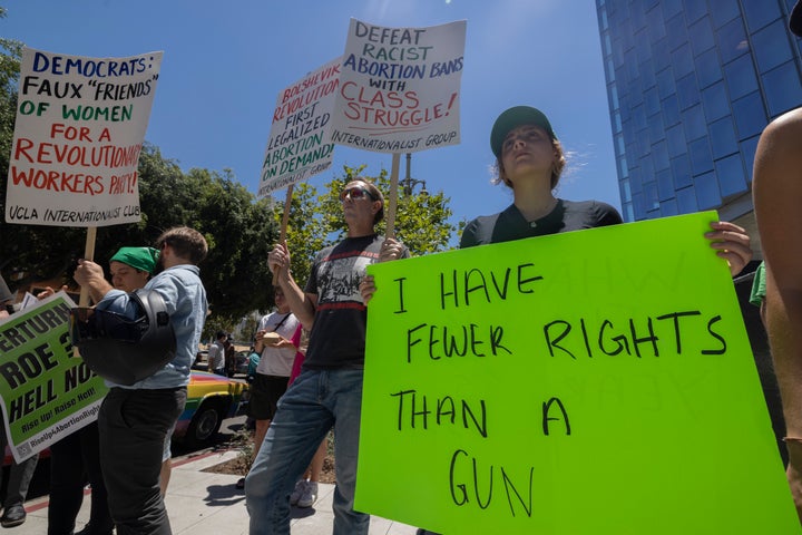 Protesters gather to denounce the Supreme Court's decision in the Dobbs v. Jackson Women's Health case Friday in Los Angeles.