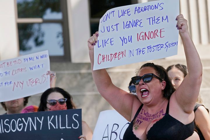 Brandi Studley, a Norman city councilwoman, participates in a "scream in" protest Friday in Norman, Oklahoma, following the Supreme Court's decision to overturn Roe v. Wade.