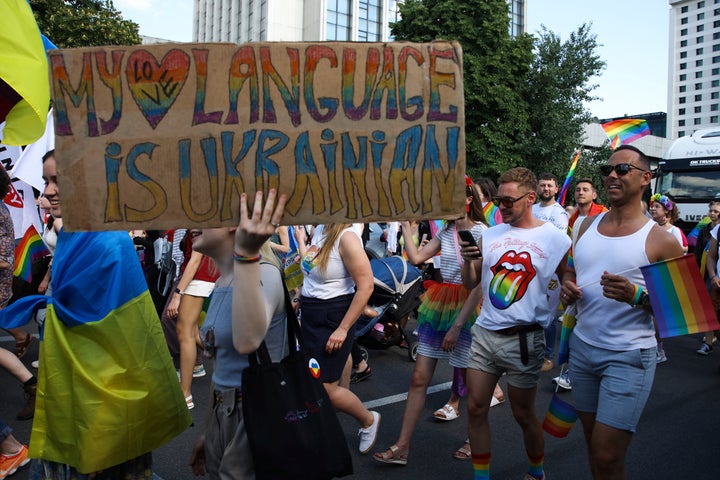 People take part in the 'Warsaw and Kyiv Pride' march for freedom in Warsaw, Poland, Saturday, June 25, 2022. Due to Russia's full-scale war against Ukraine the 10th anniversary of the equality march in Kyiv can't take place in the usual format in the Ukrainian capital. (AP Photo/Michal Dyjuk)