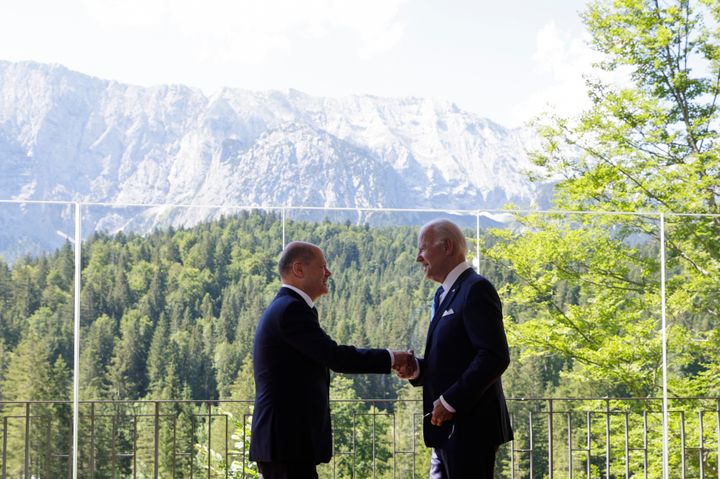 German Chancellor Olaf Scholz, left, welcomes U.S. President Joe Biden, right, for a bilateral meeting at Castle Elmau in Kruen, near Garmisch-Partenkirchen, Germany, on Sunday, June 26, 2022. The Group of Seven leading economic powers are meeting in Germany for their annual gathering Sunday through Tuesday. (Leonhard Foeger/Pool Photo via AP)