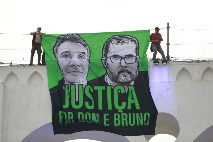 People attend a demonstration in Rio de Janeiro, Brazil, on June 26, 2022, to call for justice for the murder Brazilian indigenous expert Bruno Pereira and the British journalist Dom Phillips, who were murdered while on a reporting mission in the Amazon rainforest.