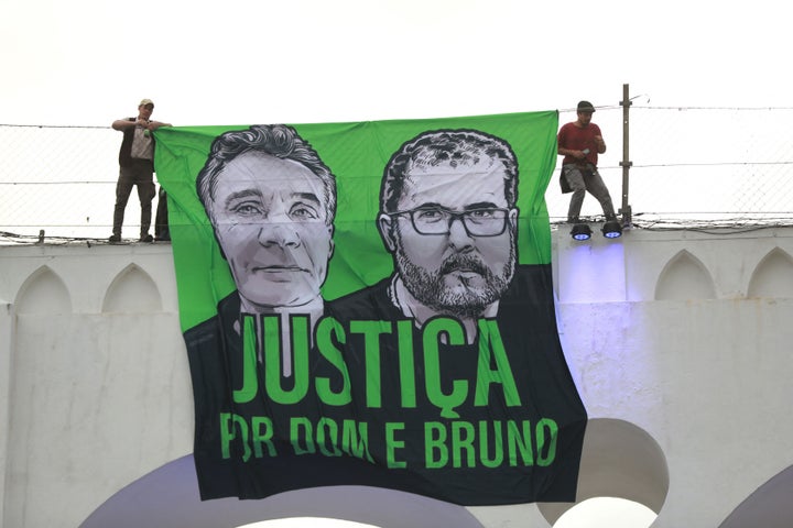 People attend a demonstration in Rio de Janeiro, Brazil, on June 26, 2022, to call for justice for the murder Brazilian indigenous expert Bruno Pereira and the British journalist Dom Phillips, who were murdered while on a reporting mission in the Amazon rainforest. 