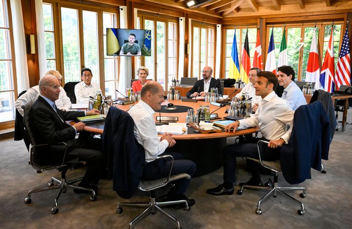 From front center clockwise, Germany's Chancellor Olaf Scholz, U.S. President Joe Biden, Britain's Prime Minister Boris Johnson, Japan's Prime Minister Fumio Kishida, European Commission President Ursula von der Leyen, European Council President Charles Michel, Italy's Prime Minister Mario Draghi, Canada's Prime Minister Justin Trudeau and France's President Emmanuel Macron have taken seat at a round table as Ukraine's President Volodymyr Zelensky addresses the G7 leaders via video link during their working session at Castle Elmau in Kruen, near Garmisch-Partenkirchen, Germany, on June 27, 2022. 