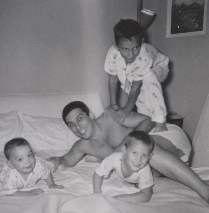 A 1959 photo shows Eugene Glick with his sons, Steve (left), Daniel (center) and Bob (on top of Eugene), who died in 2001.