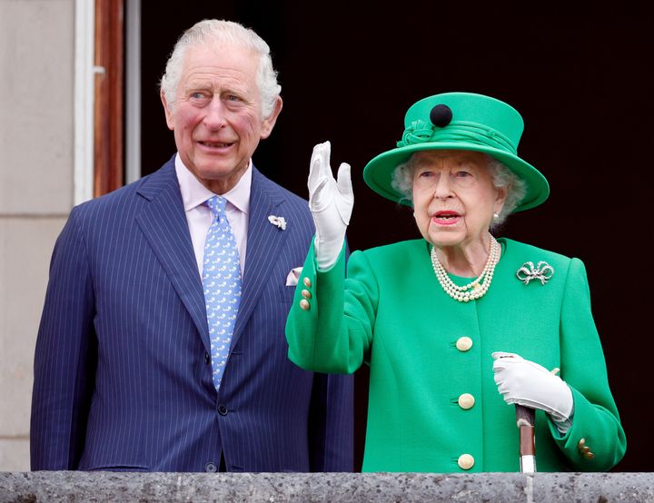 Prince Charles and Queen Elizabeth II stand on the balcony of Buckingham Palace following the Platinum Pageant on June 5 in London,
