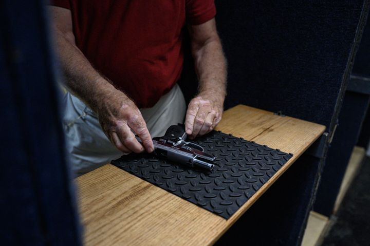 Shooting range owner John Deloca prepares his pistol at his range in Queens, New York, on June 23.
