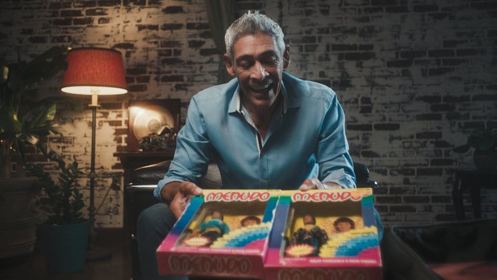 Former Menudo member Johnny Lozado displays doll replicas of the band in the docuseries.