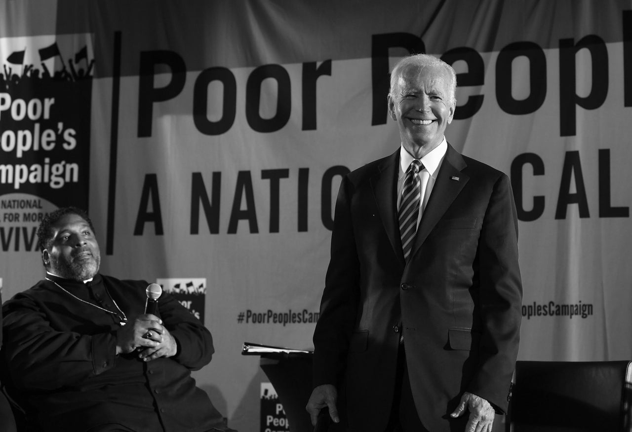 Then-presidential candidate Joe Biden speaks at the Poor People's Moral Action Congress presidential forum in Washington, D.C., on June 17, 2019. Political activist Bishop William Barber sits at left.