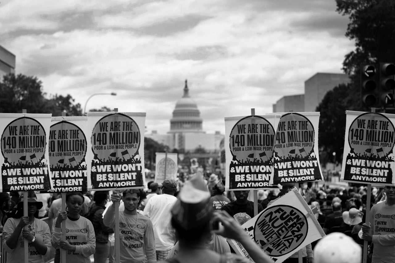 People attend a rally calling for attention to the living conditions of the low-income people and urging policymakers to do more to support those on the bottom, in Washington, D.C., on June 18.