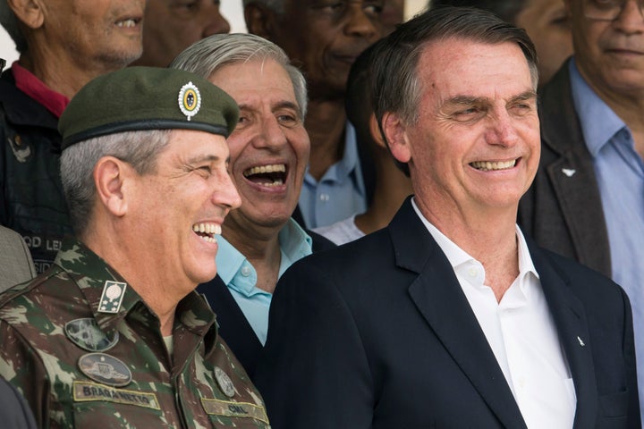 Retired Gen. Walter Braga Netto (left) has served as Brazil's defense minister and Bolsonaro's chief of staff. He reportedly threatened congressional leaders that "there would be no elections in 2022" if they didn't alter election rules to meet Bolsonaro's demands. 