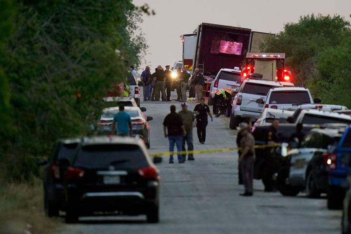 Police and other first responders work the scene where dozens of people were found dead and multiple others were taken to hospitals with heat-related illnesses Monday in Bexar County, Texas.
