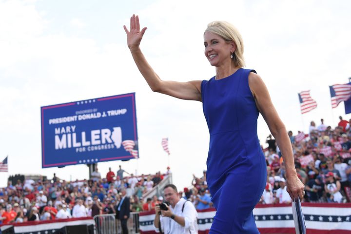 Rep. Mary Miller waves to the crowd at a rally with former President Donald Trump on Saturday. Miller beat five-term Rep. Rodney Davis to be the Republican nominee in Illinois' newly drawn 15th District.