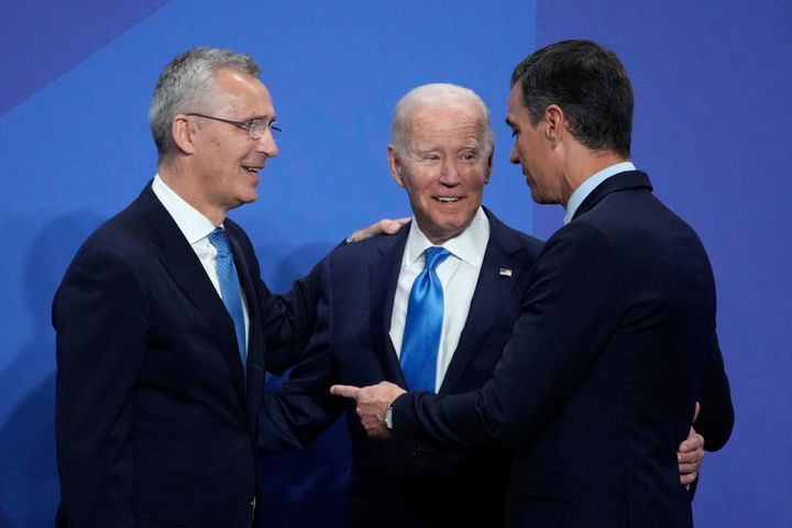 NATO Secretary General Jens Stoltenberg (L) and Spanish Prime Minister Pedro Sanchez (R) welcome U.S. President Joe Biden before a session of the NATO summit at the Ifema congress centre in Madrid, on June 29, 2022.