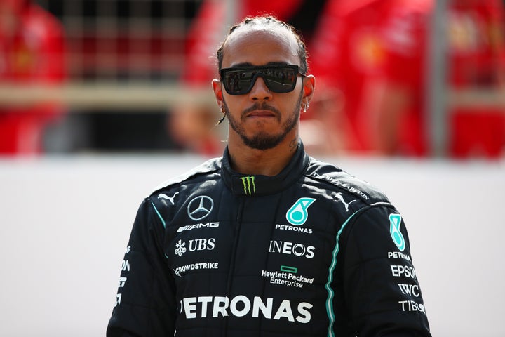 Lewis Hamilton looks on from the grid during day one of F1 Testing at Bahrain International Circuit on March 12, 2021.