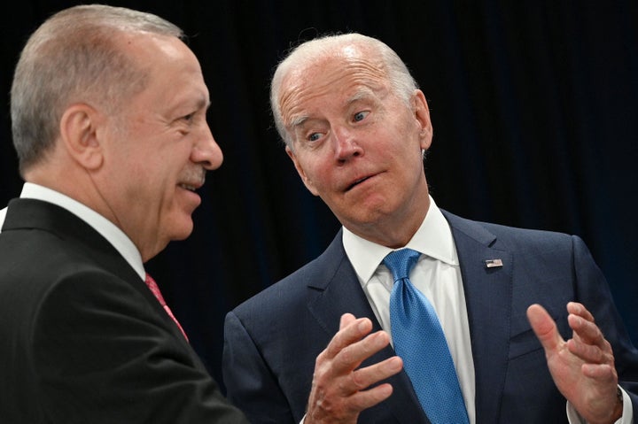 Turkey's President Recep Tayyip Erdogan speaks with U.S. President Joe Biden at the start of the first plenary session of the NATO summit in Madrid, Spain on June 29, 2022. 