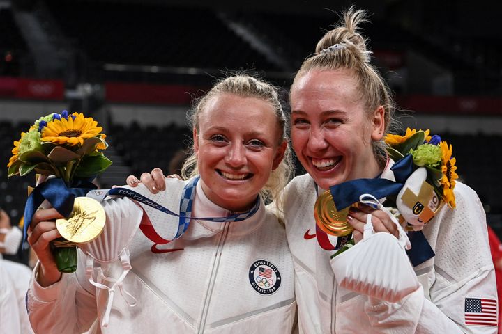 USA's Jordyn Poulter and Michelle Bartsch-Hackley pose with their gold medals during the women's volleyball victory ceremony during the Tokyo 2020 Olympic Games at Ariake Arena in Tokyo on August 8, 2021. (Photo by YURI CORTEZ / AFP) (Photo by YURI CORTEZ/AFP via Getty Images)