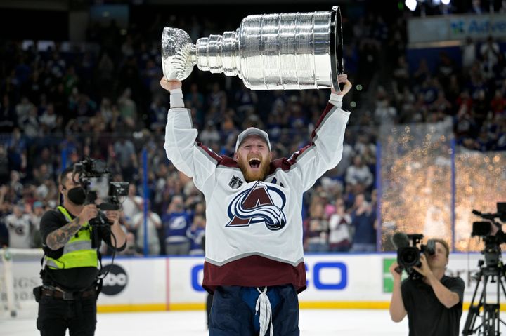 Colorado Avalanche left wing Gabriel Landeskog lifts the Stanley Cup after the team defeated the Tampa Bay Lightning in Game 6 of the NHL hockey Stanley Cup Finals on Sunday. 