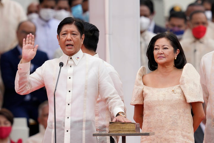 Philippine President-elect Ferdinand Marcos Jr., left, is sworn in beside his wife Maria Louise during the inauguration ceremony on June 30, 2022, in Manila, Philippines. Marcos was sworn in as the country's 17th president.
