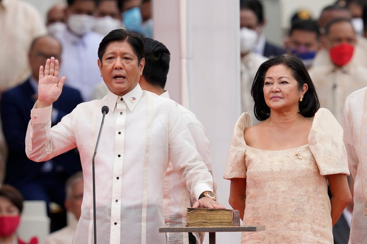 Philippine President-elect Ferdinand Marcos Jr., left, is sworn in beside his wife Maria Louise during the inauguration ceremony on June 30, 2022, in Manila, Philippines. Marcos was sworn in as the country's 17th president. 