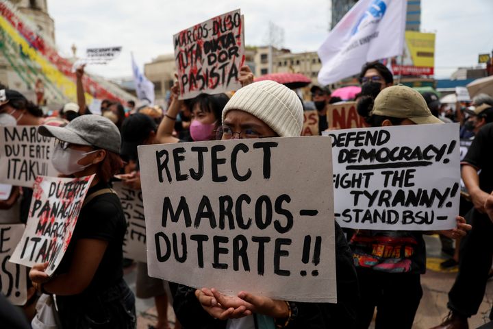 Activists hold placards against the inauguration ceremony of President-elect Ferdinand Marcos Jr. during a protest in Manila, Philippines on June 30, 2022.