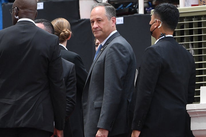 U.S. Second Gentleman Douglas Emhoff (center), husband of Vice President Kamala Harris, is flanked by security personnel as he arrives for the inaugural ceremony of new Philippine President Ferdinand Marcos Jr., at the National Museum in Manila on June 30, 2022.