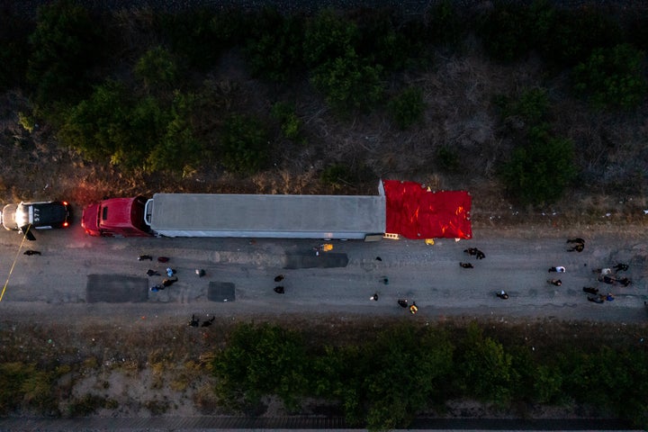An aerial view shows members of law enforcement investigate the tractor trailer in San Antonio.